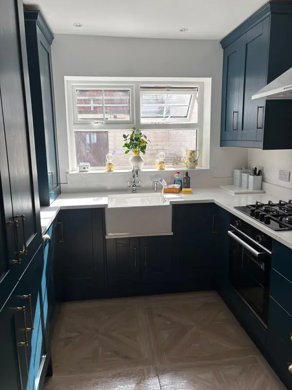 Navy kitchen with spotless worktops and Belfast sink, Belfast