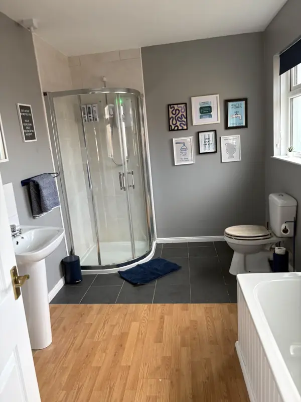 Bathroom with gleaming shower enclosure and fresh towels, Belfast