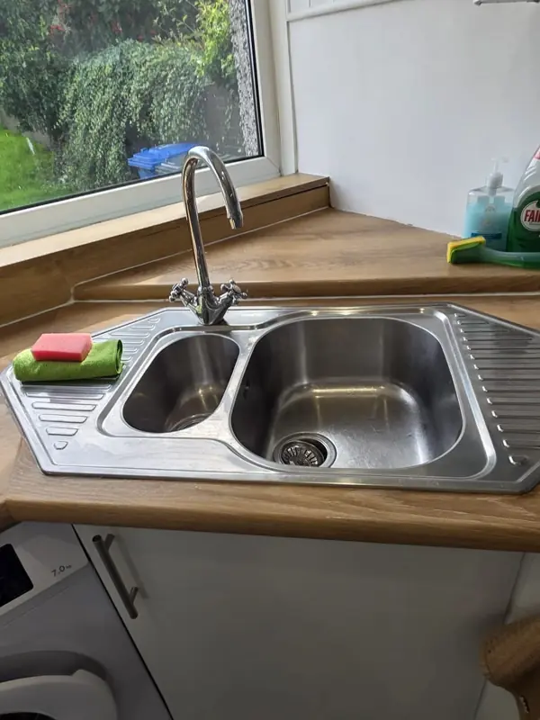 Polished stainless steel sink after cleaning, Belfast