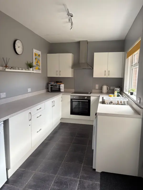 Clean white kitchen with clear worktops, Belfast