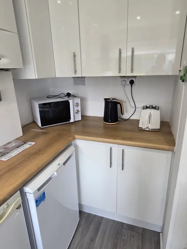 Glossy kitchen cupboards wiped and polished, Belfast