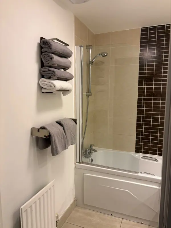 Bathroom with neatly folded fresh towels, Belfast
