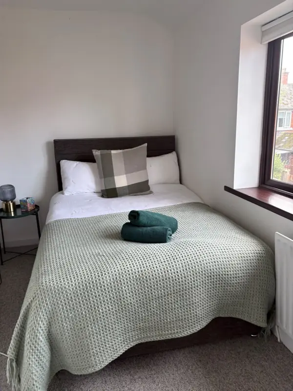 Bedroom with fresh linen and a clean window, Belfast