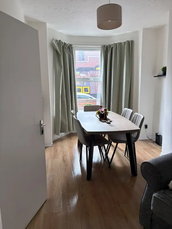 Dining room with clean table and polished floor, Belfast