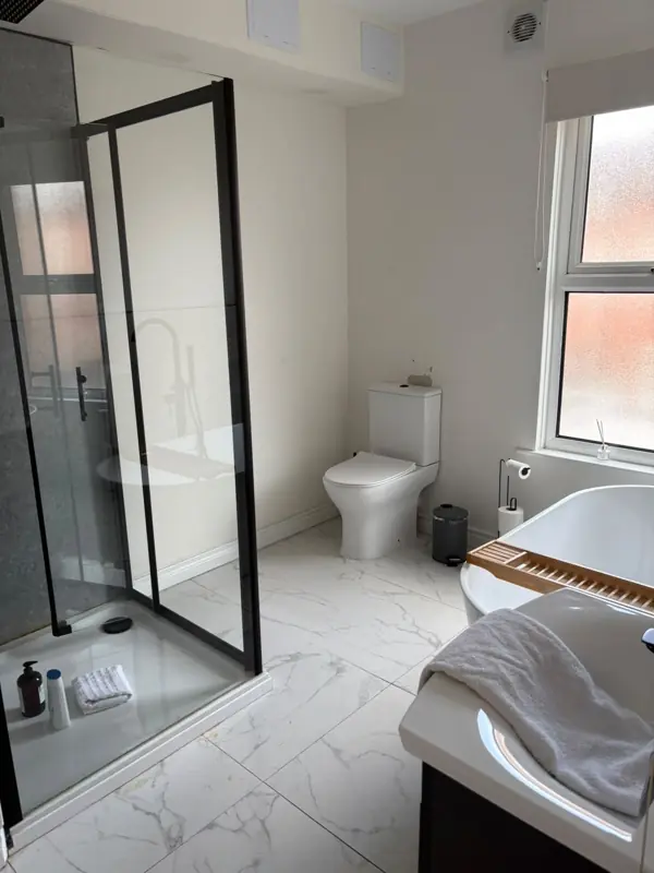 Bathroom with freestanding bath and clean tiles, Belfast